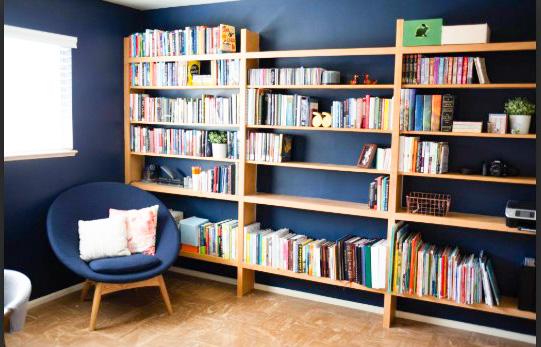 Room with a chair and bookshelves