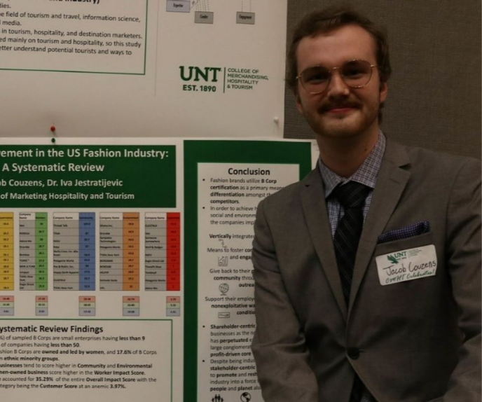 Jacob Couzens posing with research