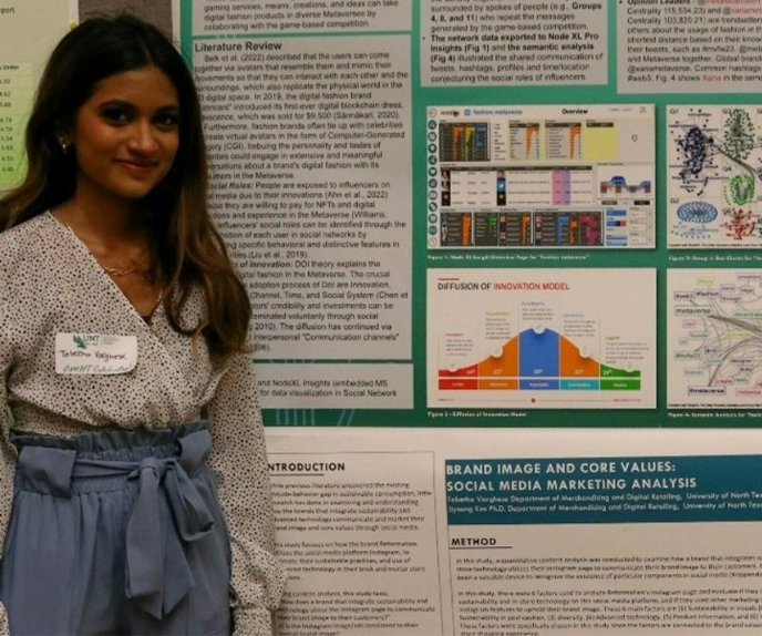 Tabetha Varghese posing with research